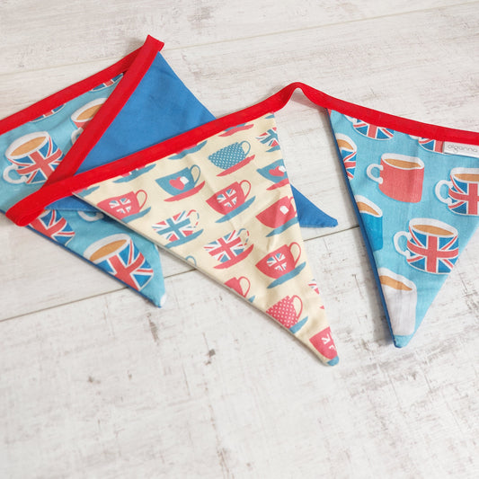 Close up fof bunting flags with tea cup and saucer and mug of tea print